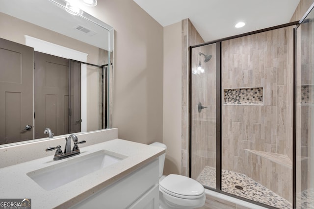 35 Cornish Creek Ln, Covington, GA 30014 - bathroom featuring a shower stall, vanity, and recessed lighting