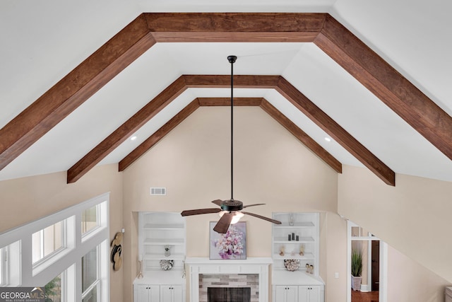 35 Cornish Creek Ln, Covington, GA 30014 - detailed view of a ceiling fan, beamed ceiling, and a tile fireplace