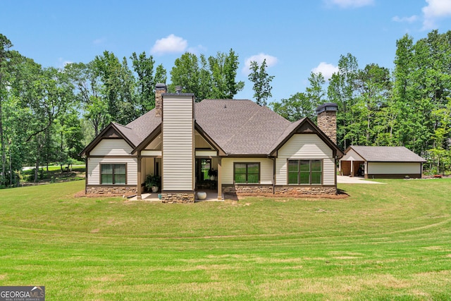 35 Cornish Creek Ln, Covington, GA 30014 - rear view of property featuring a chimney, a lawn, and roof with shingles