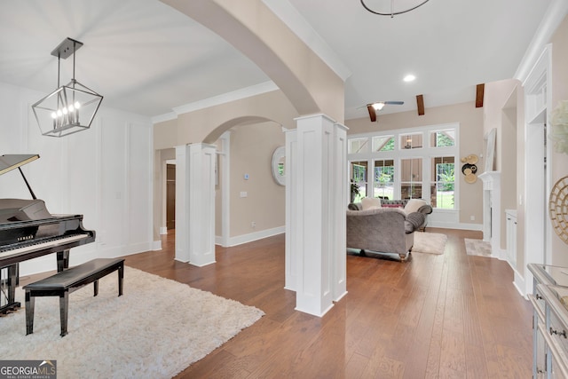 35 Cornish Creek Ln, Covington, GA 30014 - entrance foyer with ornate columns, arched walkways, hardwood / wood-style flooring, ceiling fan, and recessed lighting