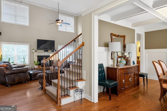 348 Willow Pointe Dr, Lagrange, GA 30240 - stairs with ceiling fan, ornamental molding, wood finished floors, a fireplace, and wainscoting