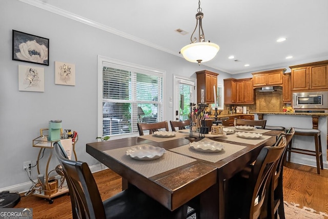 348 Willow Pointe Dr, Lagrange, GA 30240 - dining space featuring dark wood finished floors, crown molding, and recessed lighting