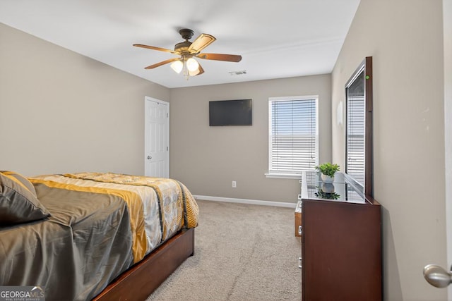 6131 Sparkling Cove Ln, Buford, GA 30518 - carpeted bedroom featuring baseboards and a ceiling fan