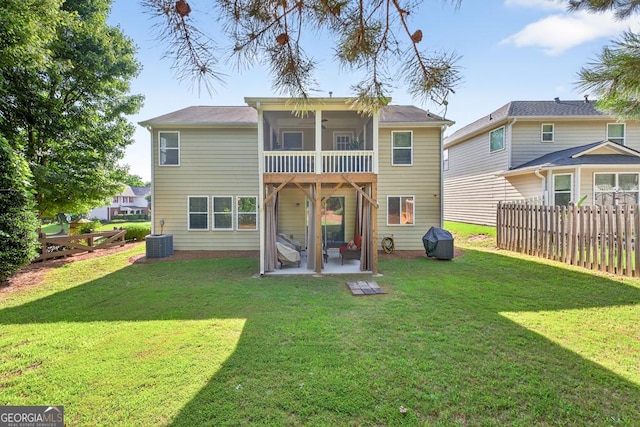 6131 Sparkling Cove Ln, Buford, GA 30518 - back of house with a patio and a sunroom