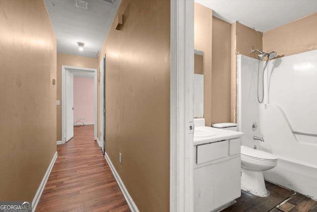 1799 Harmony Rd, Powder Springs, GA 30127 - full bathroom featuring wood finished floors, vanity, and bathtub / shower combination