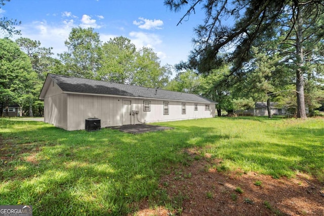 1799 Harmony Rd, Powder Springs, GA 30127 - rear view of property featuring a yard