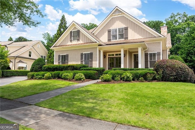 6186 Talmadge Run NW, Acworth, GA 30101 - craftsman-style home with a chimney and a front lawn