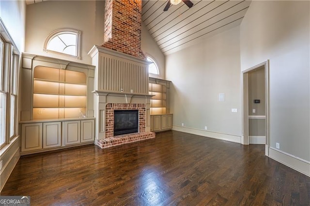 6186 Talmadge Run NW, Acworth, GA 30101 - unfurnished living room with high vaulted ceiling, a ceiling fan, a fireplace, wood finished floors, and wooden ceiling