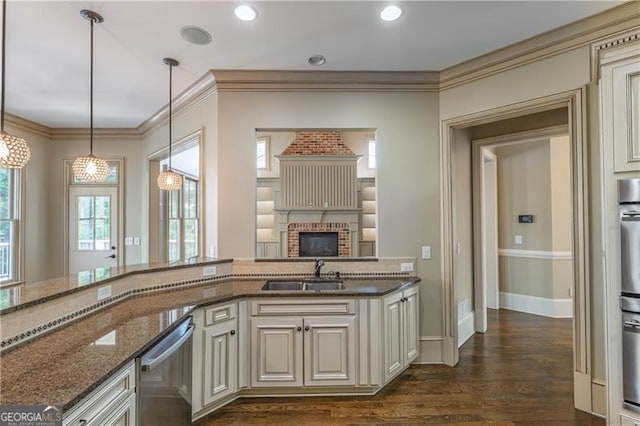 6186 Talmadge Run NW, Acworth, GA 30101 - kitchen with dishwasher, cream cabinets, dark stone counters, crown molding, and dark wood-type flooring