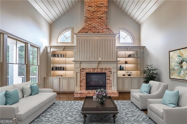 6186 Talmadge Run NW, Acworth, GA 30101 - living room with wood ceiling, high vaulted ceiling, healthy amount of natural light, a fireplace, and wood finished floors