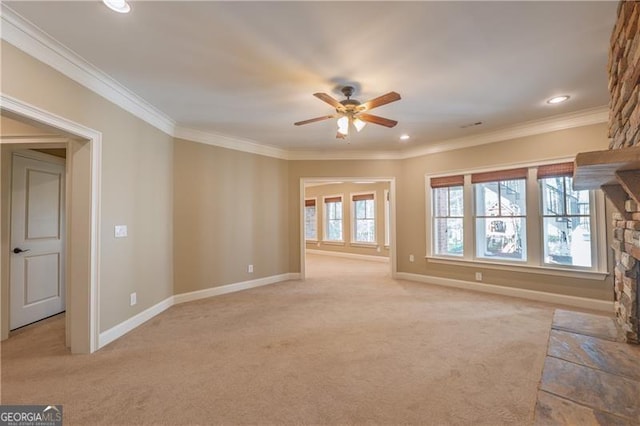 6186 Talmadge Run NW, Acworth, GA 30101 - unfurnished living room with a stone fireplace, light carpet, a ceiling fan, ornamental molding, and recessed lighting