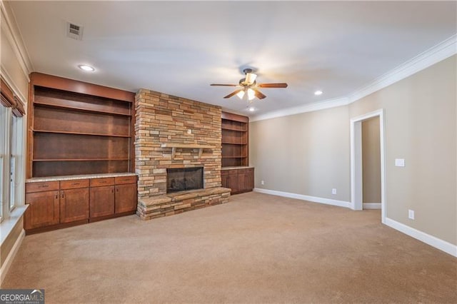 6186 Talmadge Run NW, Acworth, GA 30101 - unfurnished living room with ceiling fan, ornamental molding, light carpet, recessed lighting, and a stone fireplace