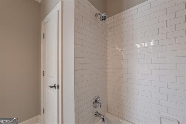 6186 Talmadge Run NW, Acworth, GA 30101 - bathroom featuring shower / bath combination and baseboards