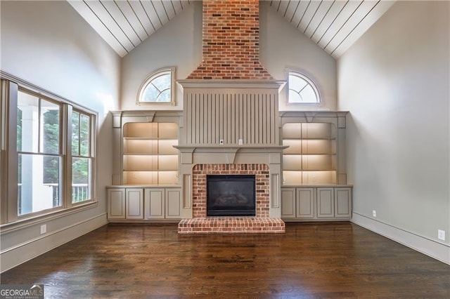 6186 Talmadge Run NW, Acworth, GA 30101 - unfurnished living room with wooden ceiling, high vaulted ceiling, a brick fireplace, and dark wood-style flooring