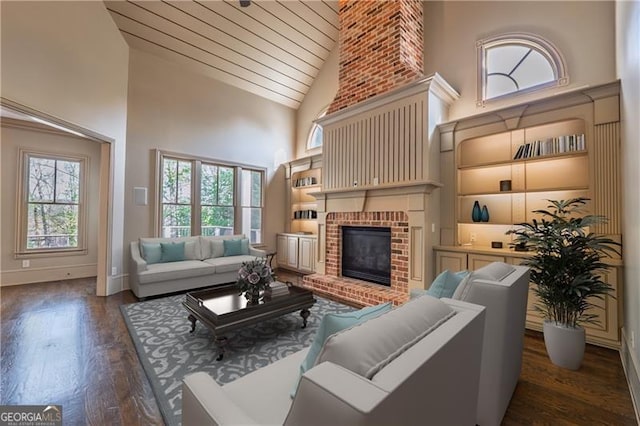 6186 Talmadge Run NW, Acworth, GA 30101 - living room featuring high vaulted ceiling, dark wood finished floors, a fireplace, and wooden ceiling