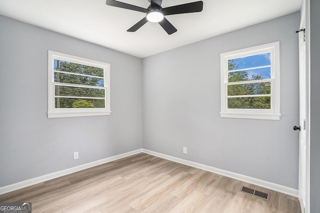 2621 Walton Way SW, Marietta, GA 30060 - unfurnished room with light wood-style flooring, healthy amount of natural light, and ceiling fan