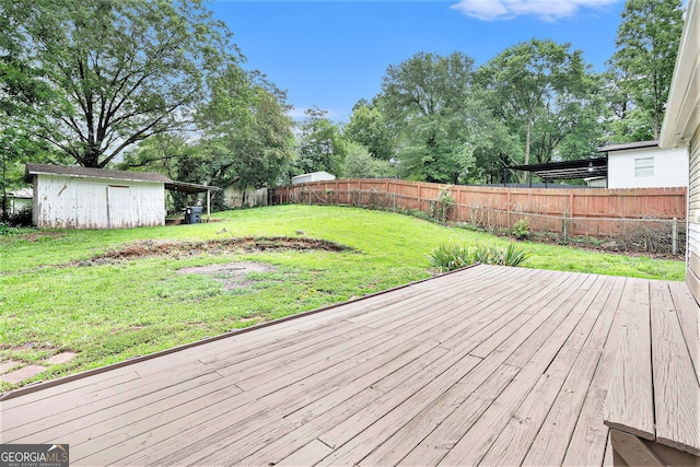 2621 Walton Way SW, Marietta, GA 30060 - deck with a fenced backyard, an outbuilding, and view of wooded area