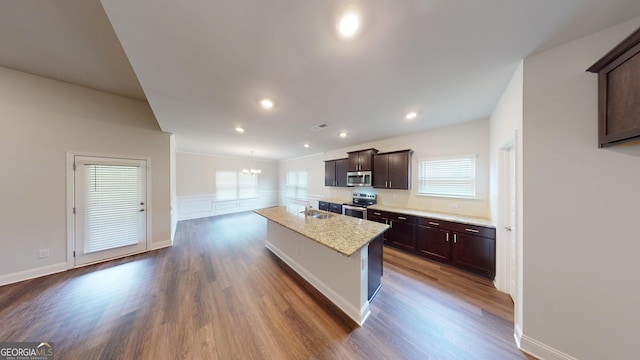 458 Southern Oaks Dr, Macon, GA 31216 - kitchen with appliances with stainless steel finishes, dark wood-style floors, a chandelier, dark brown cabinetry, and an island with sink
