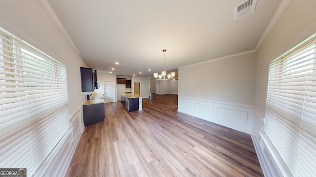 458 Southern Oaks Dr, Macon, GA 31216 - kitchen with a chandelier, open floor plan, light countertops, crown molding, and wood finished floors