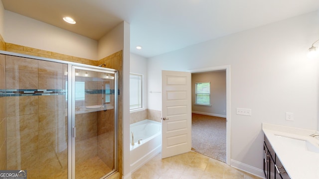 458 Southern Oaks Dr, Macon, GA 31216 - full bathroom with vanity, a garden tub, tile patterned flooring, a stall shower, and recessed lighting