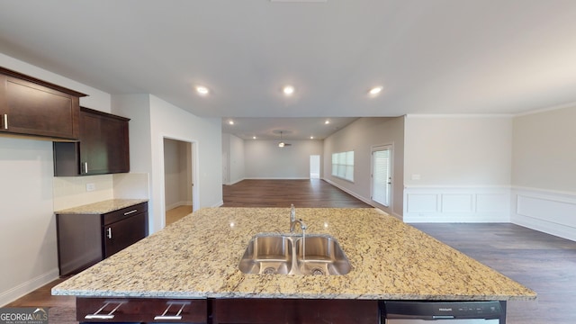 458 Southern Oaks Dr, Macon, GA 31216 - kitchen featuring open floor plan, dark brown cabinetry, an island with sink, stainless steel dishwasher, and light stone counters
