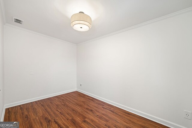 1891 W Forrest Ave, Atlanta, GA 30344 - empty room featuring crown molding and dark wood finished floors
