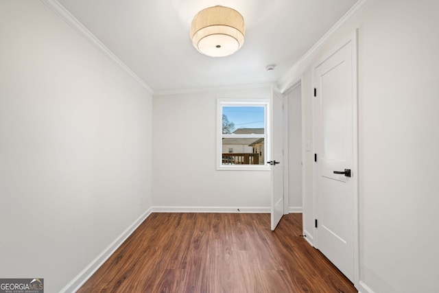 1891 W Forrest Ave, Atlanta, GA 30344 - unfurnished bedroom featuring dark wood finished floors and crown molding