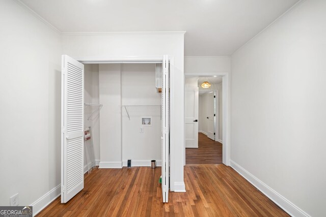 1891 W Forrest Ave, Atlanta, GA 30344 - laundry room with hookup for a washing machine, wood finished floors, and ornamental molding