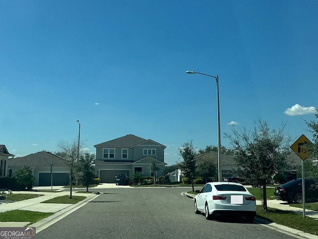 541 Buchannan Dr, Davenport, FL 33837 - view of asphalt street with sidewalks, curbs, traffic signs, street lighting, and a residential view