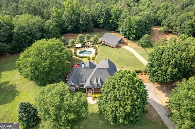 1421 Jack Malcom Rd, Madison, GA 30650 - aerial view of property and surrounding area featuring a heavily wooded area and a pool area