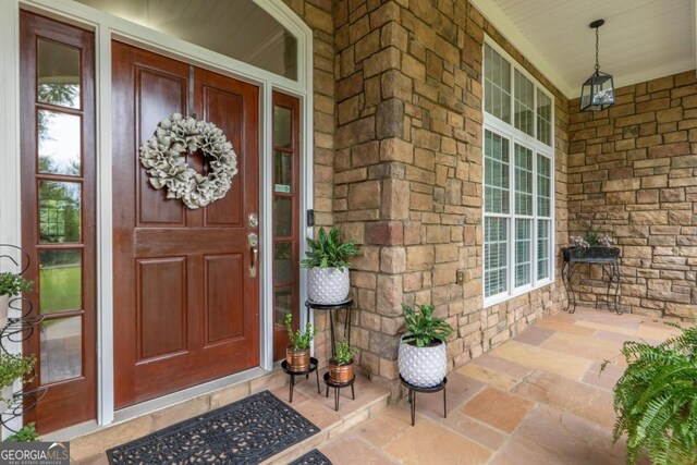 1421 Jack Malcom Rd, Madison, GA 30650 - entrance to property featuring covered porch and stone siding