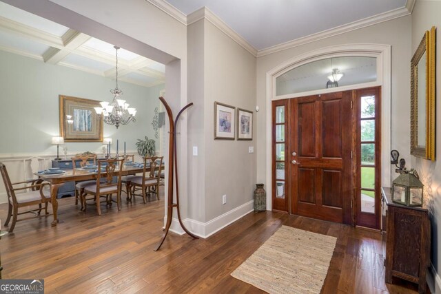 1421 Jack Malcom Rd, Madison, GA 30650 - foyer entrance with dark wood-type flooring, a chandelier, beam ceiling, ornamental molding, and coffered ceiling