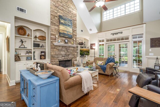 1421 Jack Malcom Rd, Madison, GA 30650 - living room featuring a high ceiling, french doors, ceiling fan, dark wood-type flooring, and a fireplace