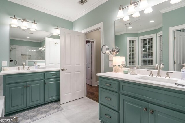 1421 Jack Malcom Rd, Madison, GA 30650 - bathroom featuring two vanities, a stall shower, ornamental molding, and recessed lighting