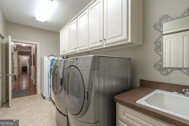 1421 Jack Malcom Rd, Madison, GA 30650 - washroom with cabinet space and washer and clothes dryer