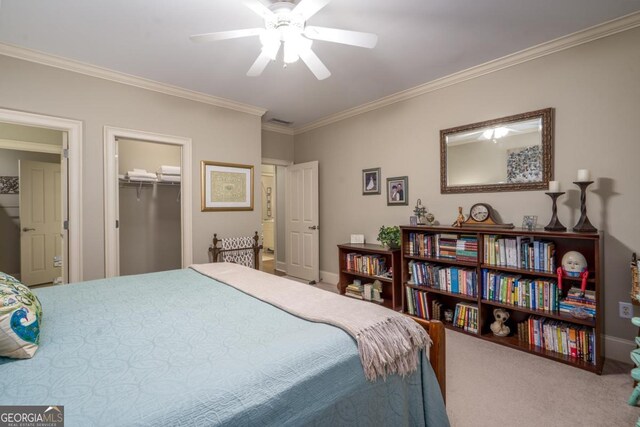 1421 Jack Malcom Rd, Madison, GA 30650 - bedroom featuring ornamental molding, carpet floors, ceiling fan, a closet, and a walk in closet