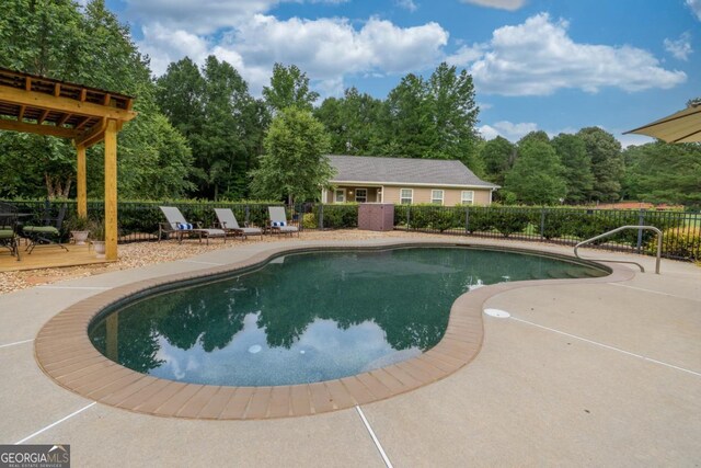 1421 Jack Malcom Rd, Madison, GA 30650 - view of swimming pool with a deck, view of wooded area, and a patio