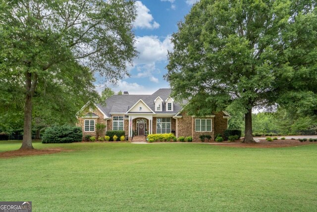 1421 Jack Malcom Rd, Madison, GA 30650 - traditional-style home featuring a front lawn and brick siding