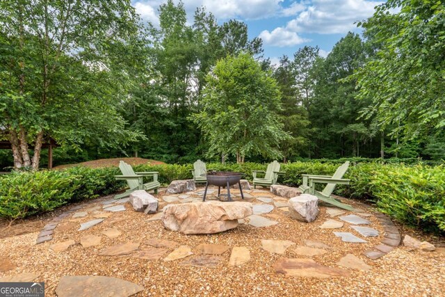1421 Jack Malcom Rd, Madison, GA 30650 - view of patio / terrace with a fire pit