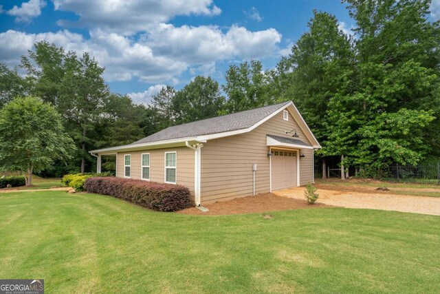 1421 Jack Malcom Rd, Madison, GA 30650 - detached garage featuring dirt driveway and view of wooded area