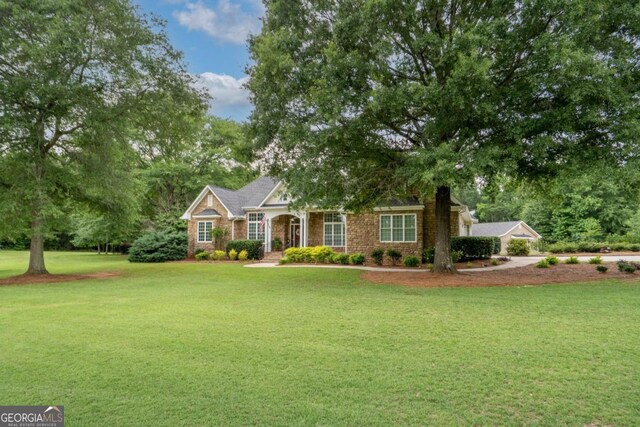 1421 Jack Malcom Rd, Madison, GA 30650 - view of front of house with a front lawn