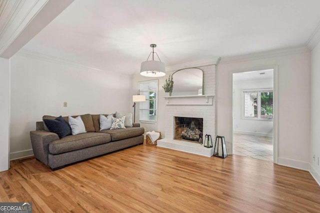 1501 Memory Ln SE, Smyrna, GA 30080 - living area with wood finished floors, crown molding, and a fireplace