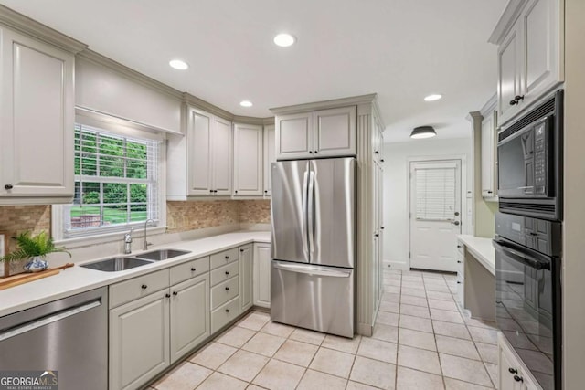 1501 Memory Ln SE, Smyrna, GA 30080 - kitchen featuring appliances with stainless steel finishes, light countertops, backsplash, and recessed lighting