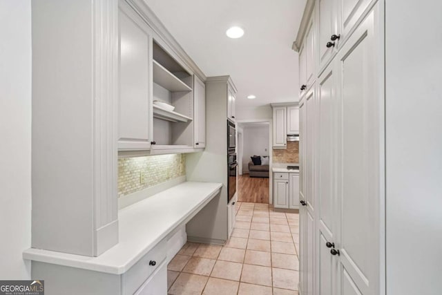 1501 Memory Ln SE, Smyrna, GA 30080 - kitchen with recessed lighting, decorative backsplash, light countertops, light tile patterned floors, and open shelves