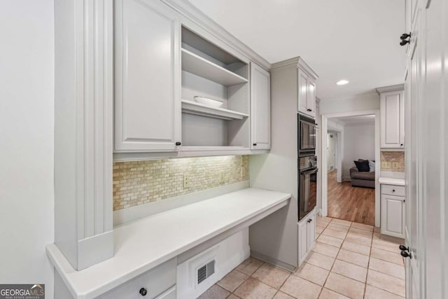 1501 Memory Ln SE, Smyrna, GA 30080 - kitchen featuring black appliances, open shelves, decorative backsplash, light tile patterned flooring, and light countertops