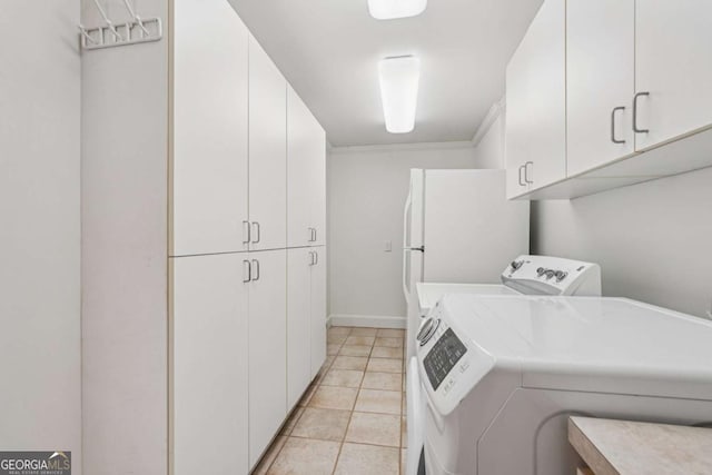 1501 Memory Ln SE, Smyrna, GA 30080 - laundry room with independent washer and dryer, cabinet space, and light tile patterned floors
