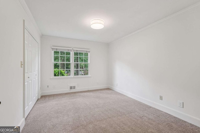 1501 Memory Ln SE, Smyrna, GA 30080 - unfurnished bedroom featuring carpet floors, crown molding, and a closet