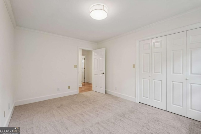 1501 Memory Ln SE, Smyrna, GA 30080 - unfurnished bedroom featuring crown molding, carpet floors, and a closet