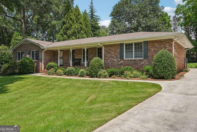 1501 Memory Ln SE, Smyrna, GA 30080 - ranch-style house with a front lawn, brick siding, driveway, and covered porch