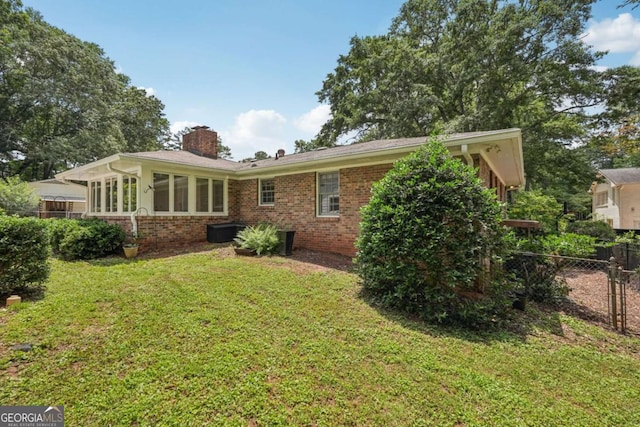 1501 Memory Ln SE, Smyrna, GA 30080 - back of property featuring brick siding and a chimney